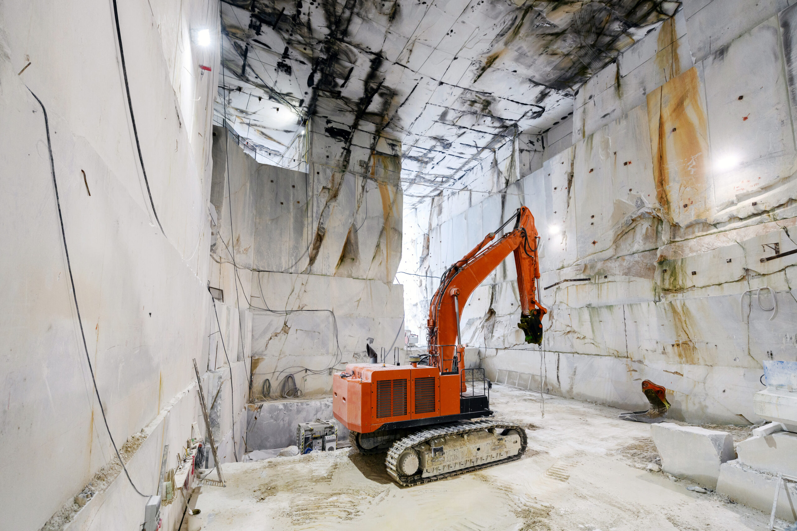 Large excavator inside a Carrara marble quarry